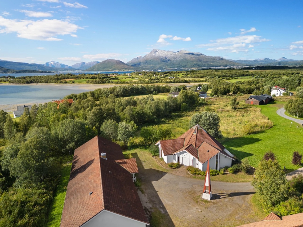 Aerial view of buildings and mountains at Trøsen 47