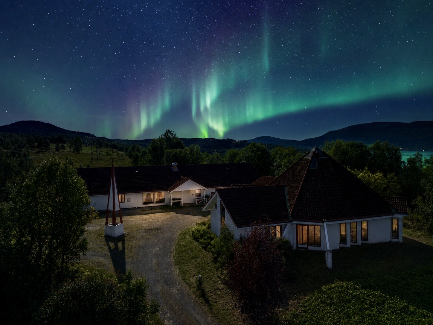 Northern lights above Evenskjer Guesthouse and the surrounding landscape